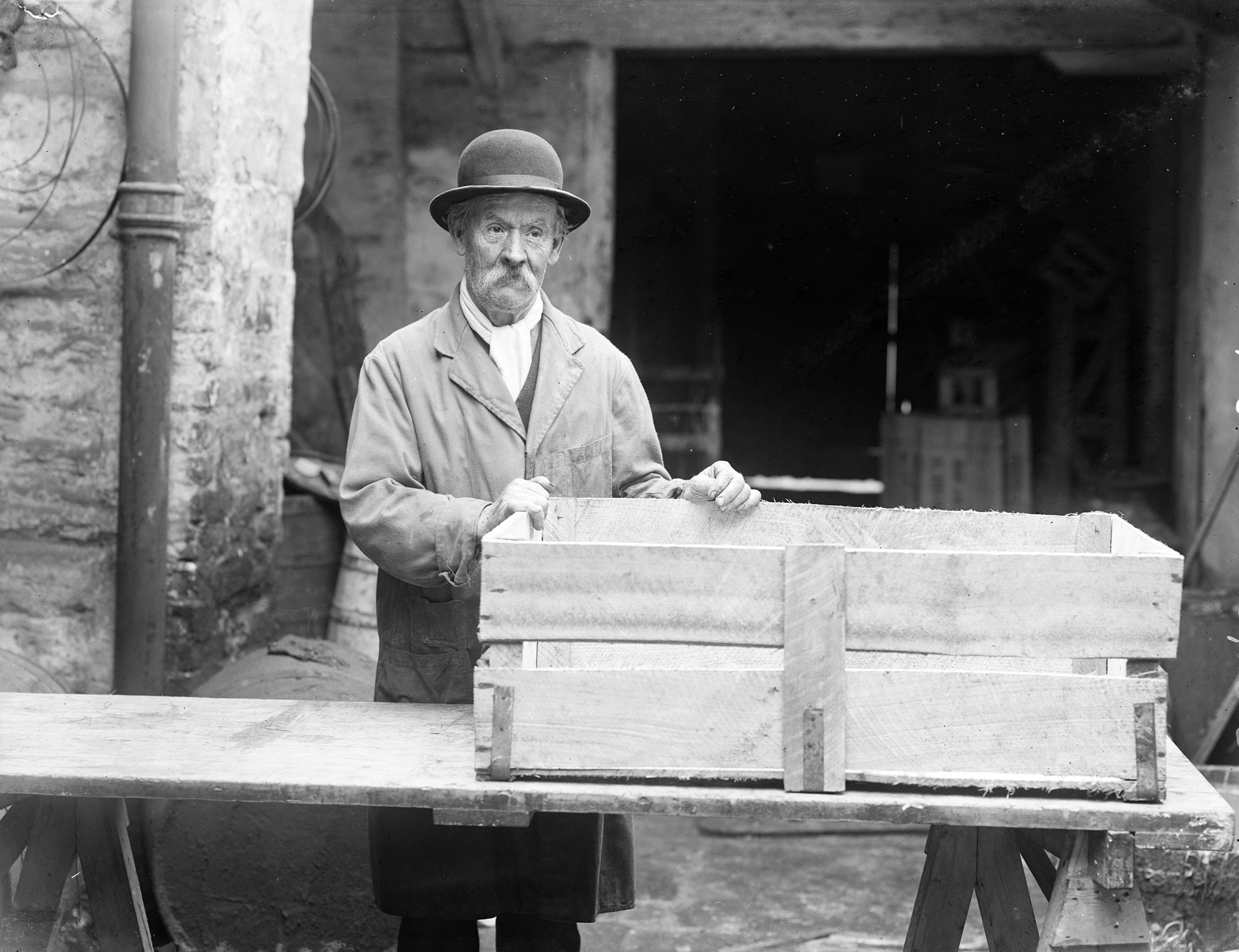 Male with hat and boxes, Waterford, Ireland 1930s (5896548007)