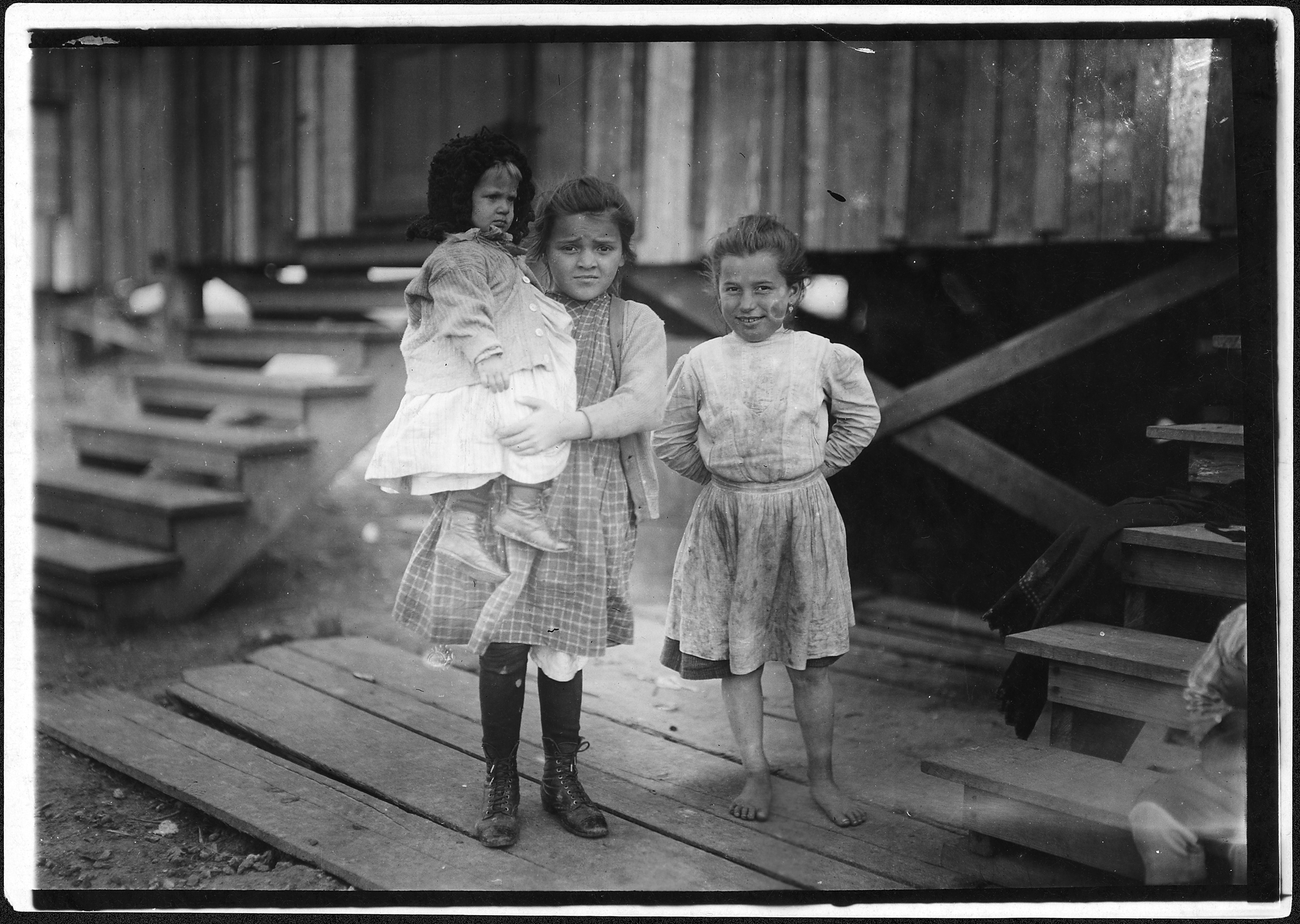 Millie, (about 7 years old) and Mary John (with baby) 8 years old. Both shuck oysters. This is Mary's second year.... - NARA - 523404