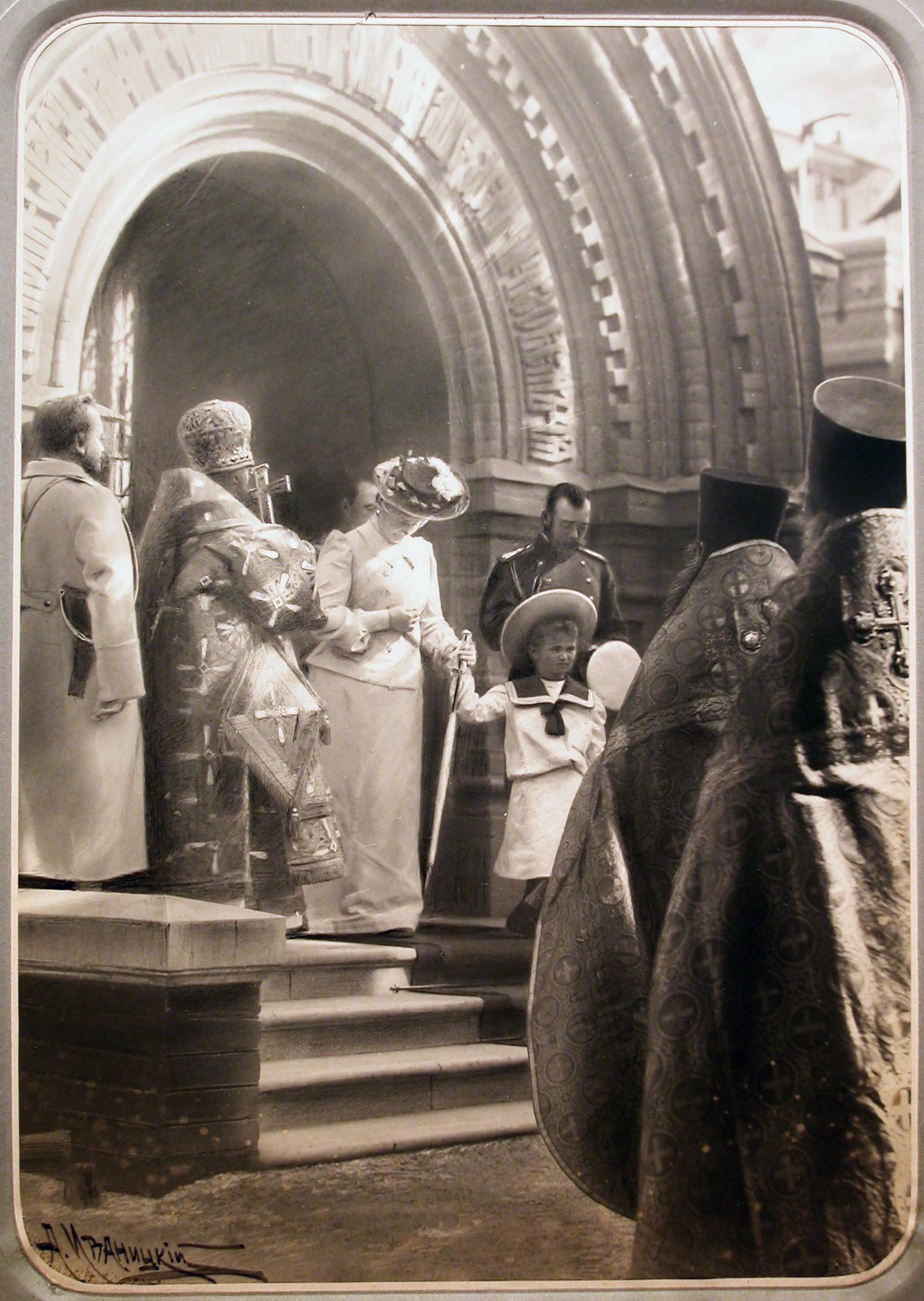 Nicholas II, Alexandra and Olga Nikolaevna come out of the Chapel