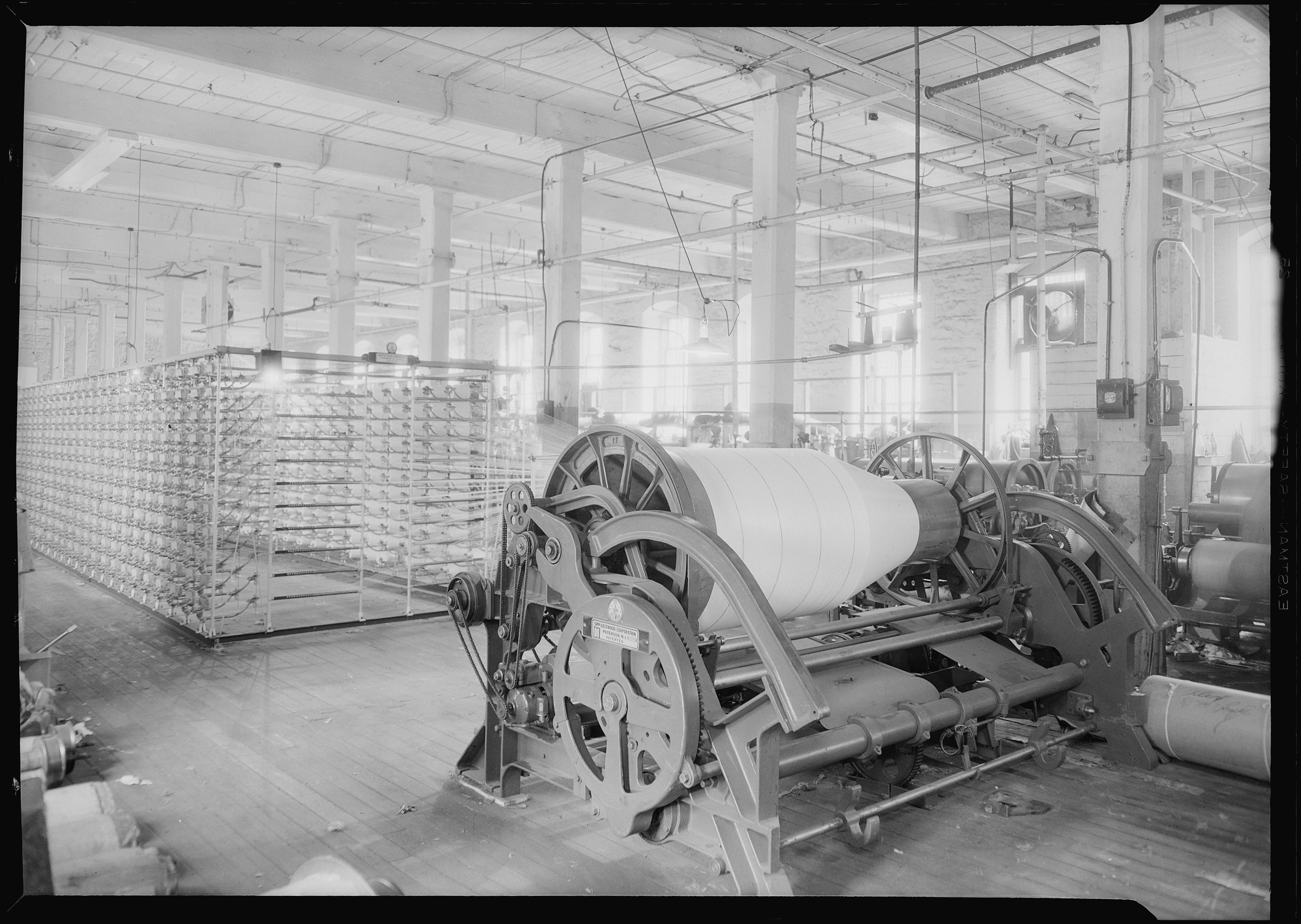 Paterson, New Jersey - Textiles. (Another view of large textile machine.) - NARA - 518767