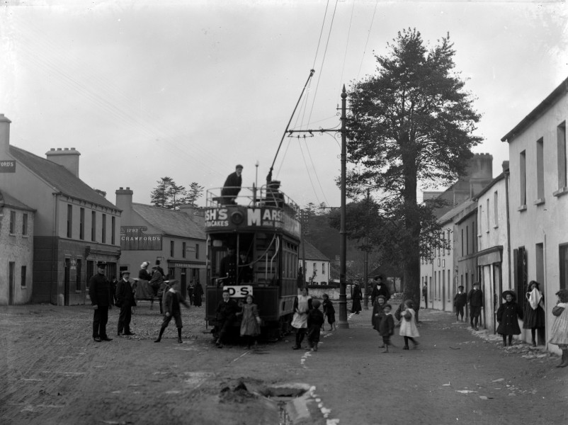A street scene in Cork with tram and passengers! (16222787771)