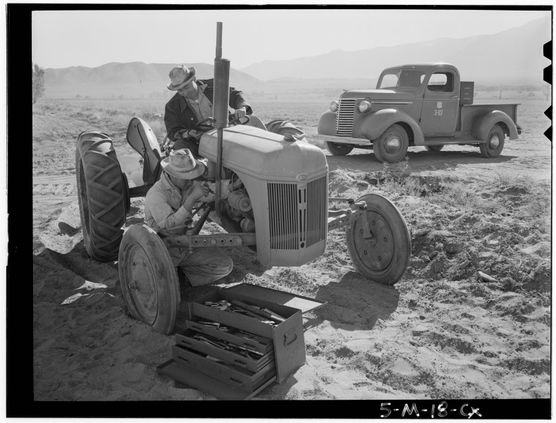 Ansel Adams Manzanar - Tractor repair- Driver Benji Iguchi, Mechanic Henr - LOC ppprs-00120