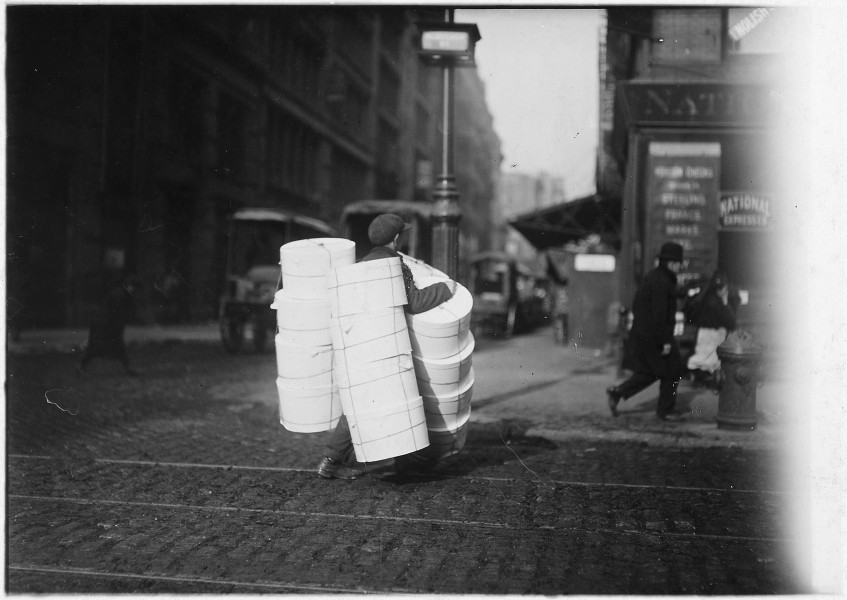 Boy carrying hats. New York City. - NARA - 523519