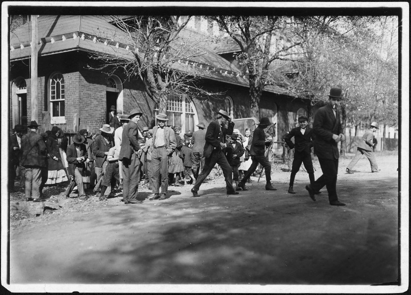 Closing hour, Saturday noon, at Dallas Mill. Every child in photo, so far as I was able to ascertain, works in that... - NARA - 523352