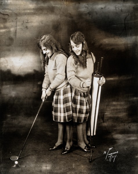 Daisy and Violet Hilton, conjoined twins, dressed for golf. Wellcome V0029590