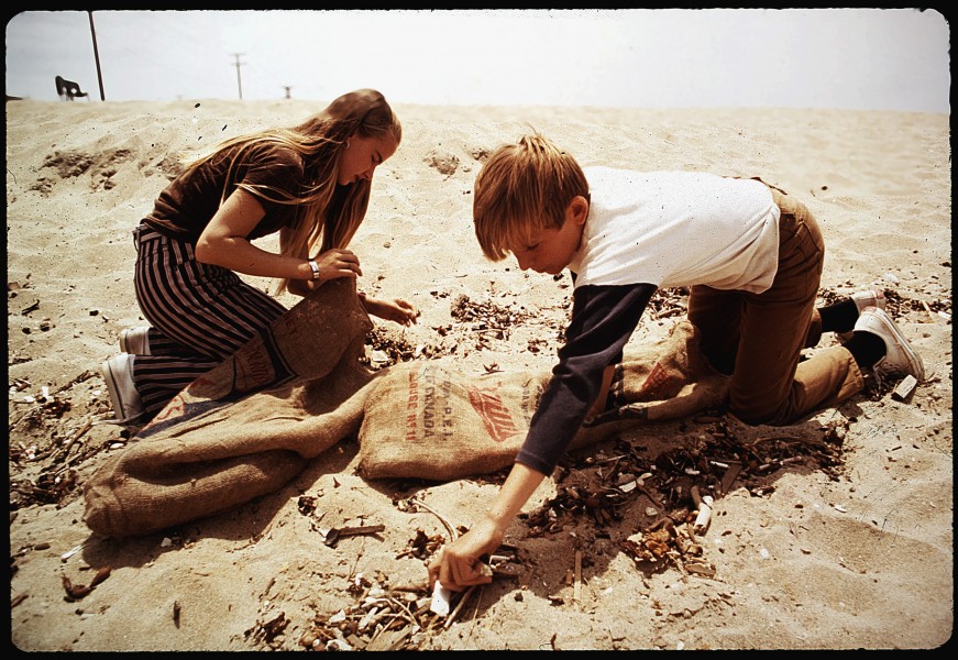 EIGHTH GRADE STUDENTS FROM ST. BONAVENTURE HIGH SCHOOL SPEND RECESS PERIOD PICKING UP LITTER ON BEACH NEAR OIL WELLS - NARA - 542657