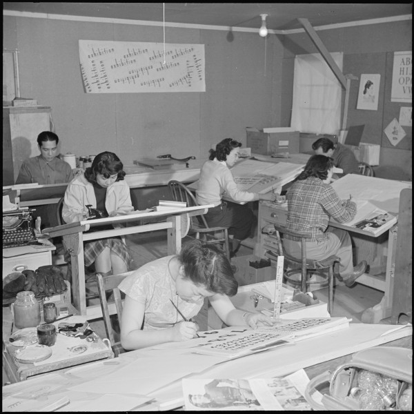 Heart Mountain Relocation Center, Heart Mountain, Wyoming. Artists at work in the Poster Shop at th . . . - NARA - 539153