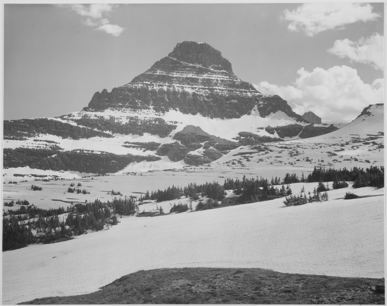 Looking across barren land to mountains, 