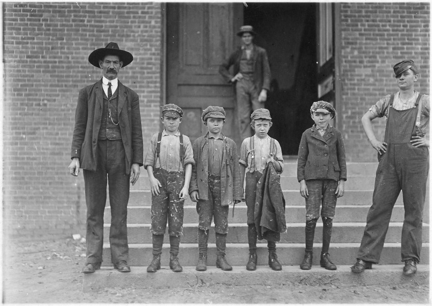 Loray Mill, Gastonia, N.C. Boy with coat in hand is 11 years old. Been there 9 months. Started at 50 (cents) a day... - NARA - 523107