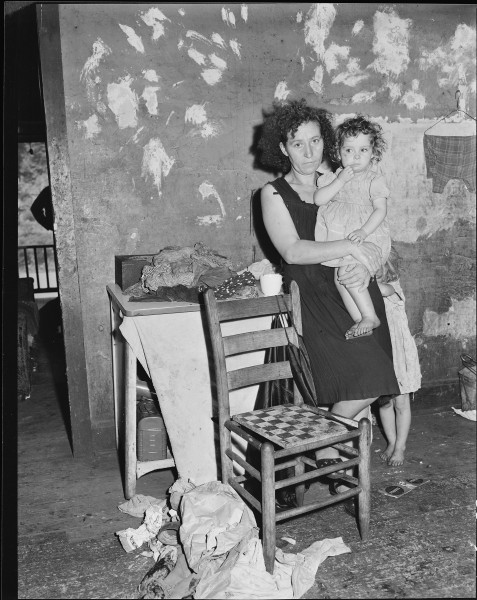 Mrs. Elige Hicks and her daughter in the kitchen of the four room house which rents for $10.50 monthly. Mrs. Hicks'... - NARA - 541034