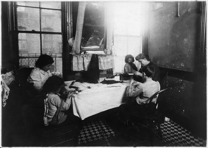 Mrs. Molinari and family making feathers. 6 year old Antoinette ties like an old hand. Dominick, 9, works some.... - NARA - 523511