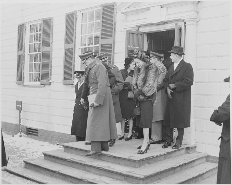 Photograph of a group of dignitaries, including British Field Marshal Harold Alexander and his wife, leaving George... - NARA - 199504