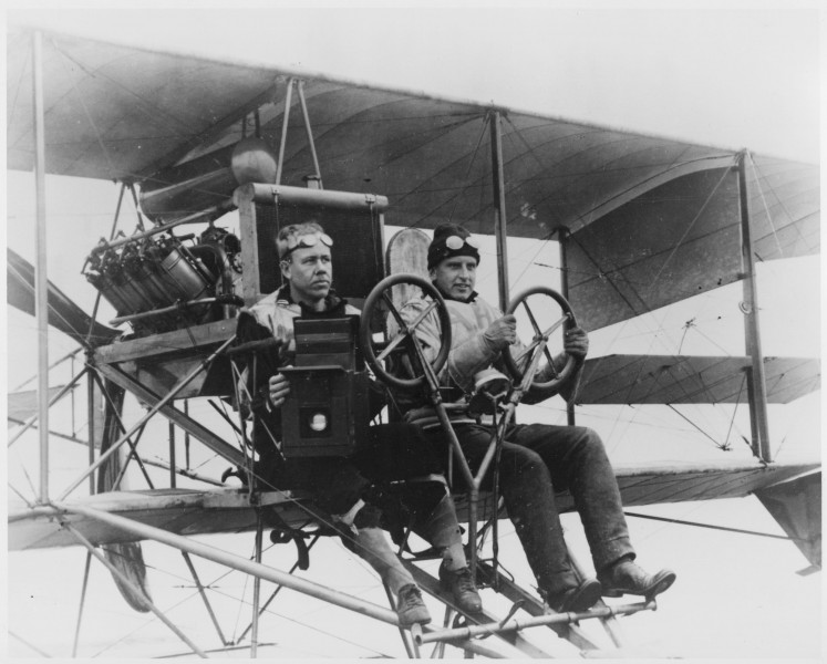 Pilot and photographer in AH-14 aircraft with Graflex camera. - NARA - 295605