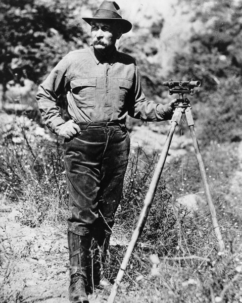 Portrait of William Mulholland with a surveyor's scope on a tripod, ca.1908-1913 (CHS-14459)