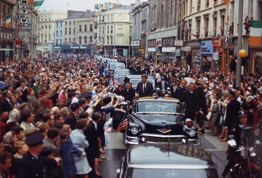 President Kennedy greets spectators during trip to Ireland