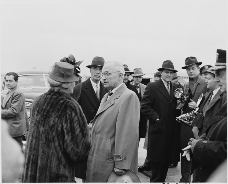 President Truman at National Airport in Washington, D. C. is talking with Mrs. George Marshall. Secretary of State... - NARA - 199675