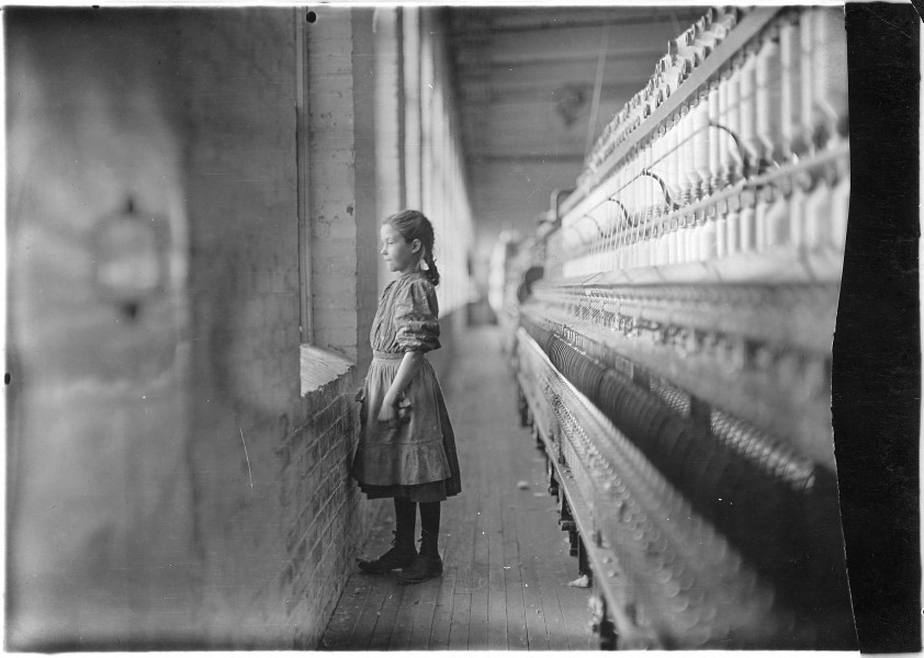 Rhodes Mfg. Co. Spinner. A moments glimpse of the outer world. Said she was 11 years old. Been working over a year.... - NARA - 523106