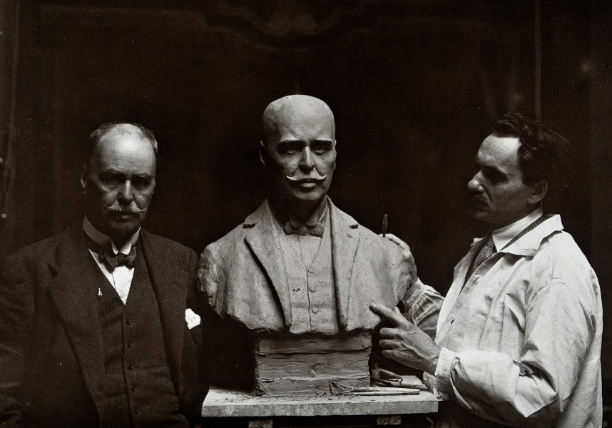 Sir Ronald Ross standing next to a bust of himself, and Jank Wellcome V0027103