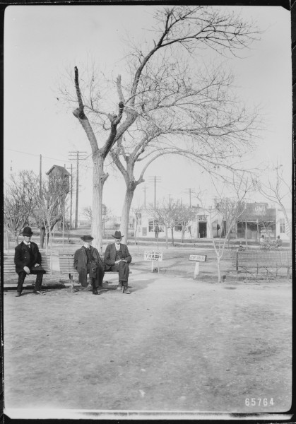 Three gentlemen pass the time on a park bench in San Jacinto Plaza, El Paso, Texas, 1906 - NARA - 523026