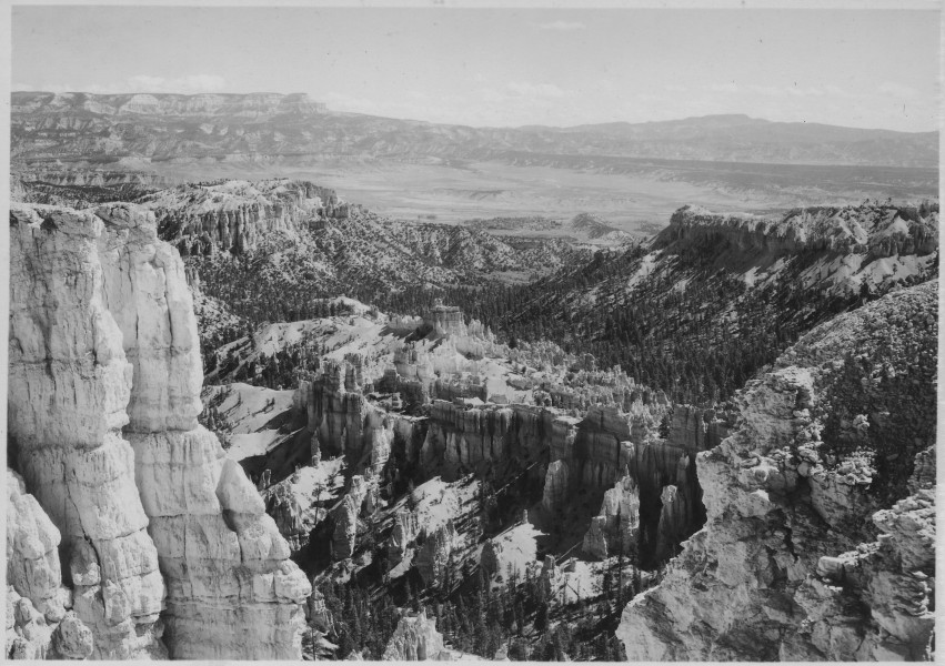 View east from Inspiration Point, rim of Bryce Canyon, showing Bryce Temple Ridge, the foot of the Canyon, the... - NARA - 520227