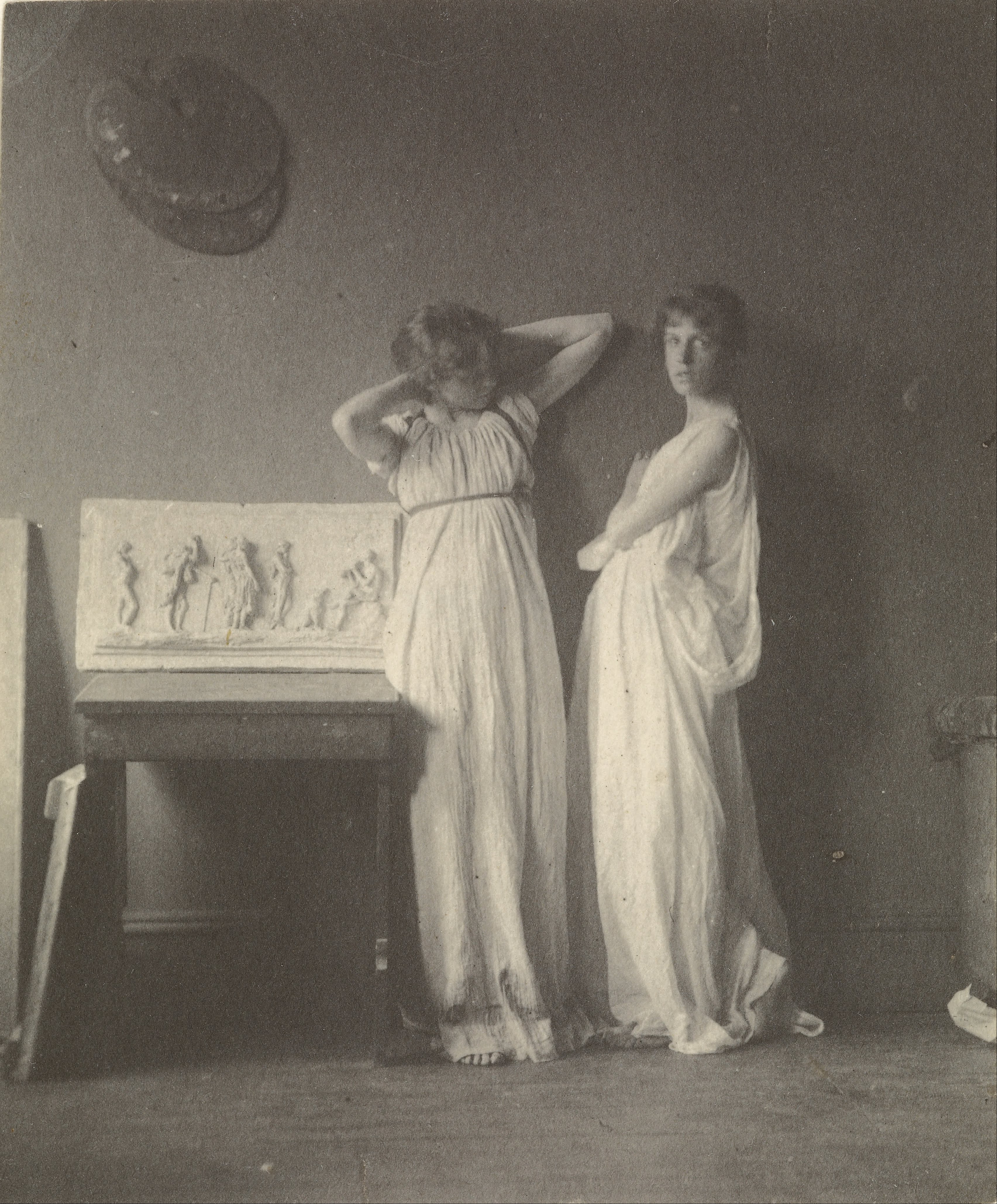 Thomas Eakins (American - (Two Female Models in Classical Costume with Eakins' Sculpture 