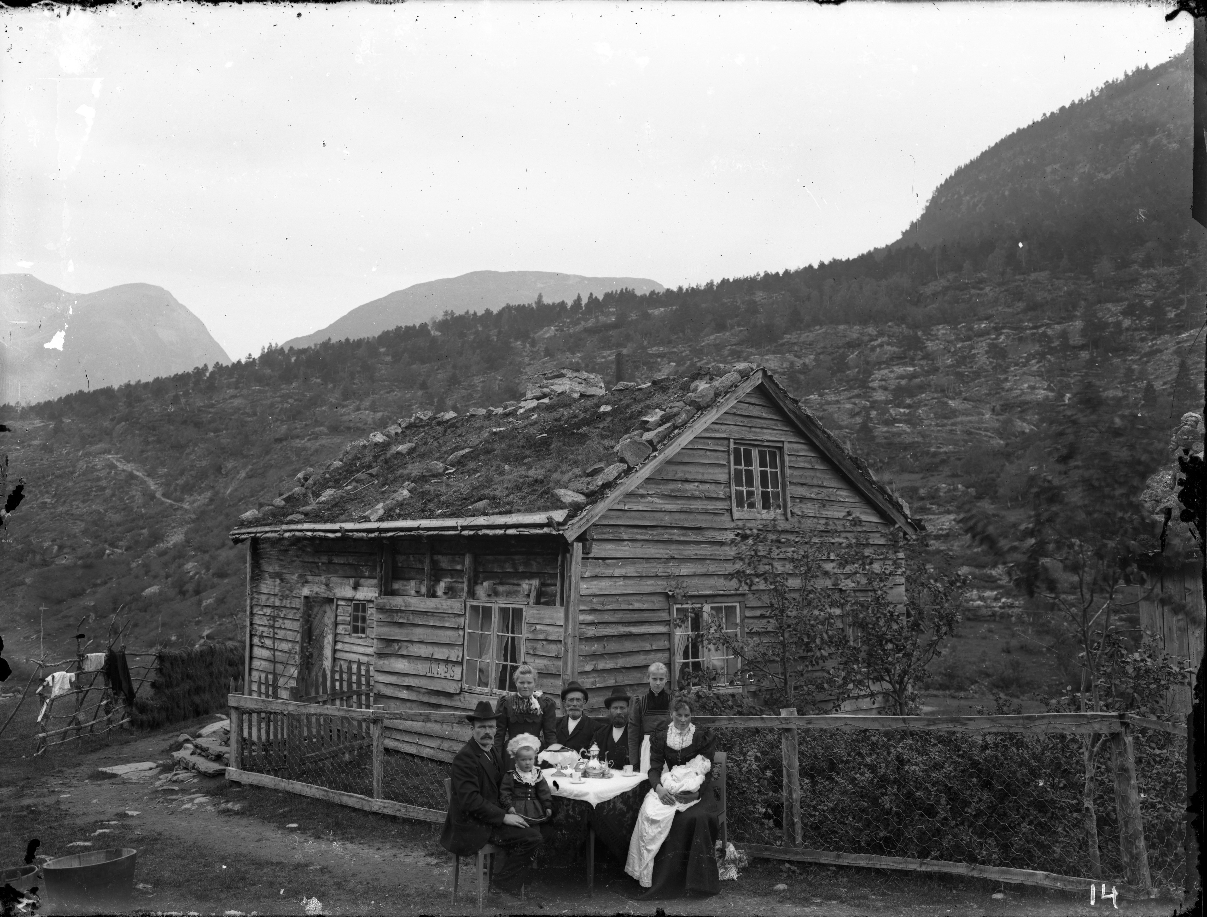 A family outside their home.