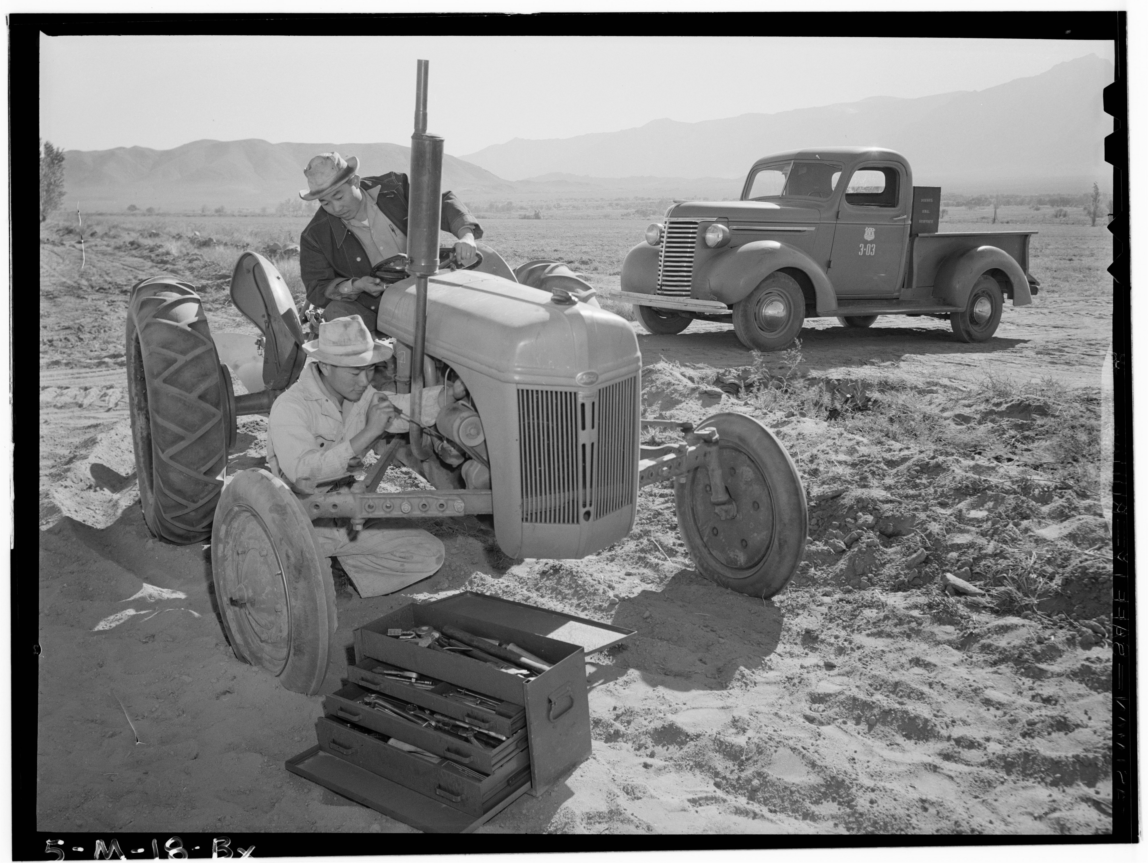 Ansel Adams Manzanar - Tractor repair- Driver Benji Iguchi, Mechanic Henr - LOC ppprs-00119