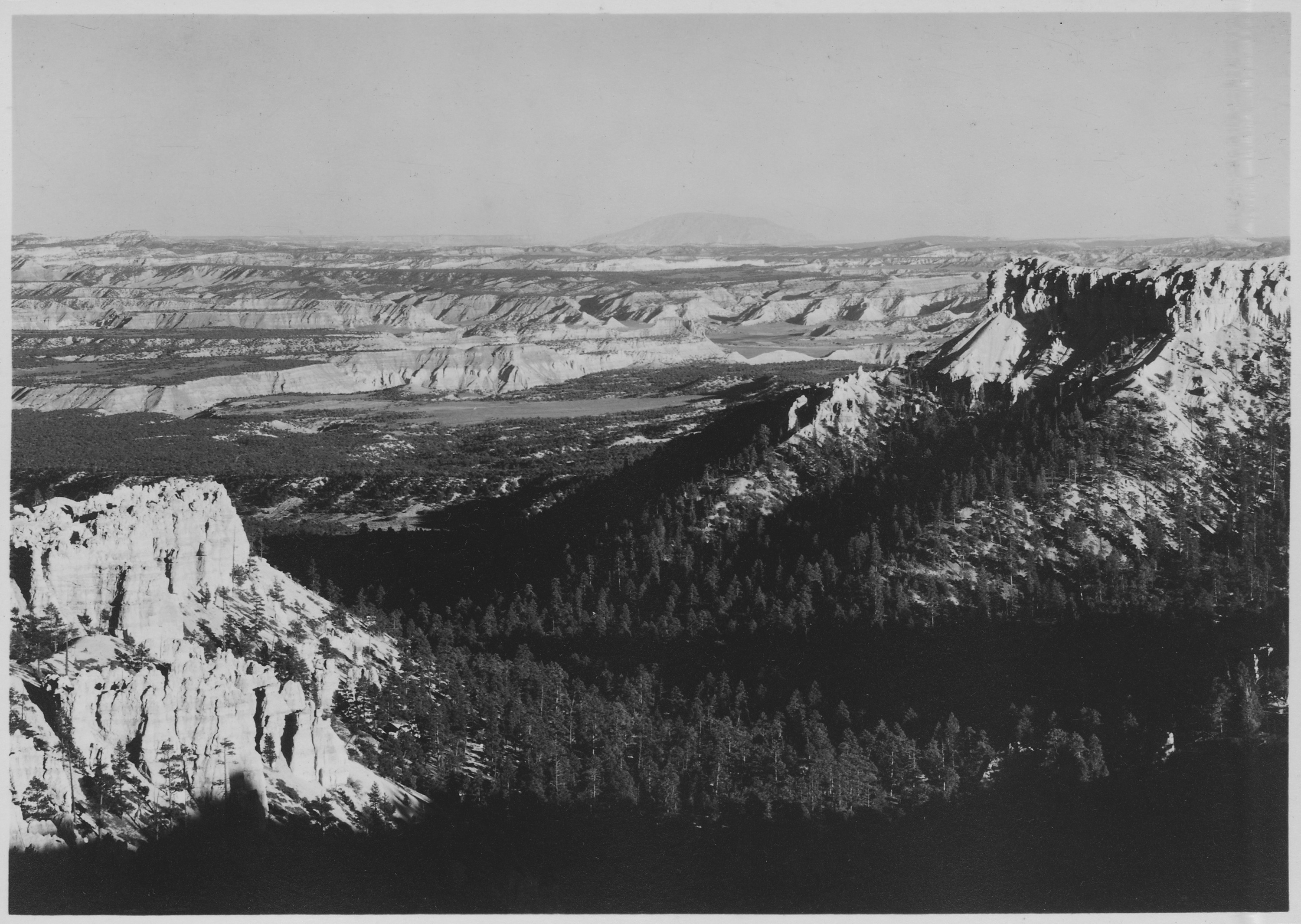 View east from rim in fromt of Bryce Canyon Lodge to the bottom of the Canyon, over the valley of the Pahreah River... - NARA - 520229