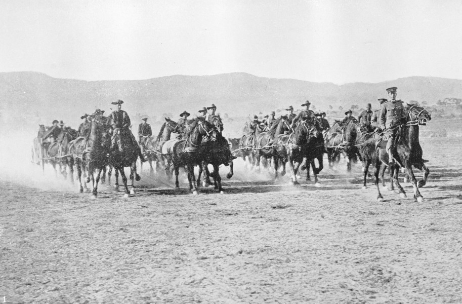Soldiers- at Brighton Camp, Tasmania- practicing a charge on horse- back with artillery waggons (1914) (13705006204)