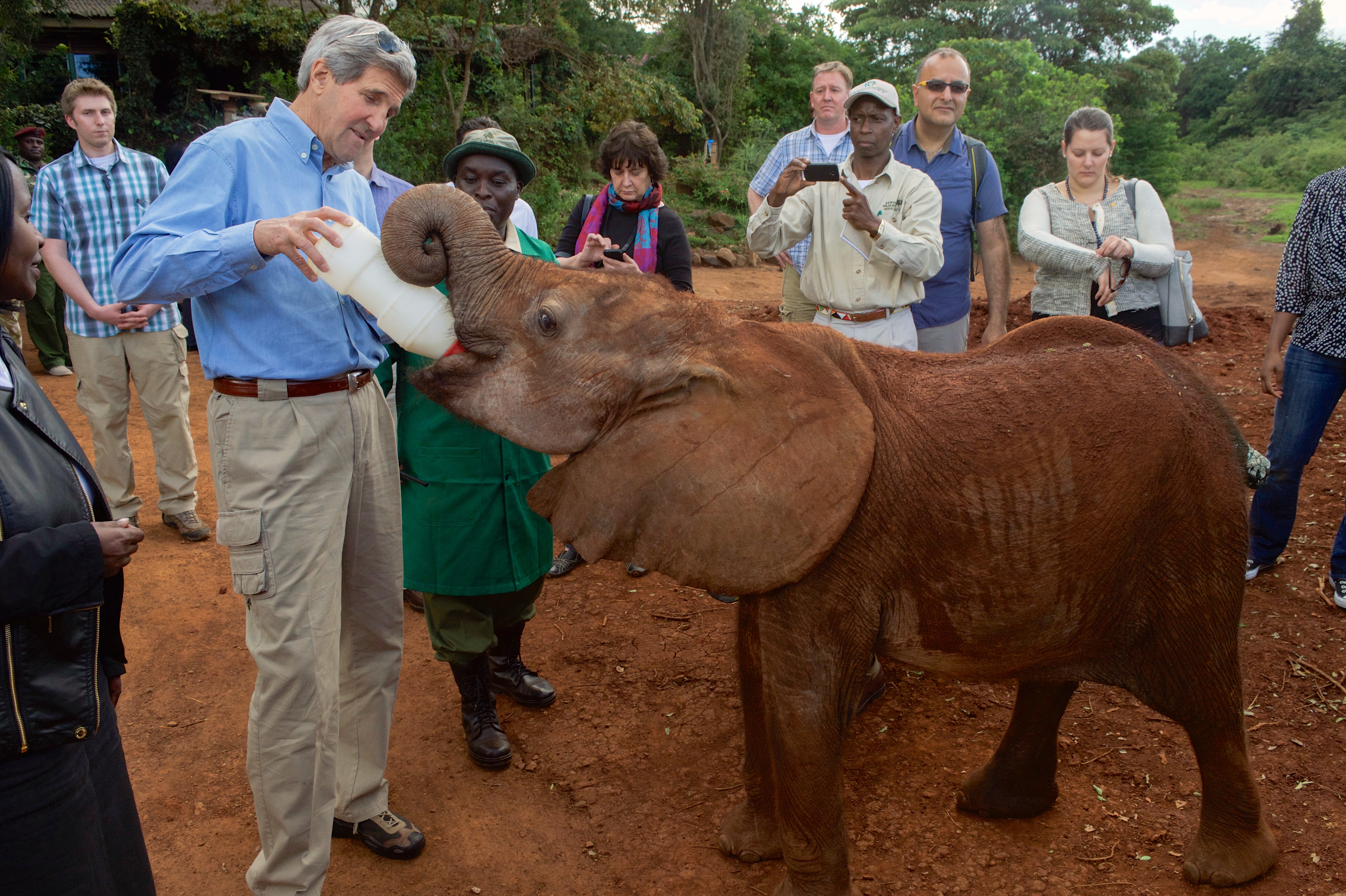 Secretary Kerry Feeds a Baby Elephant at the Sheldrick Elephant Orphanage in Nairobi (17332222906)