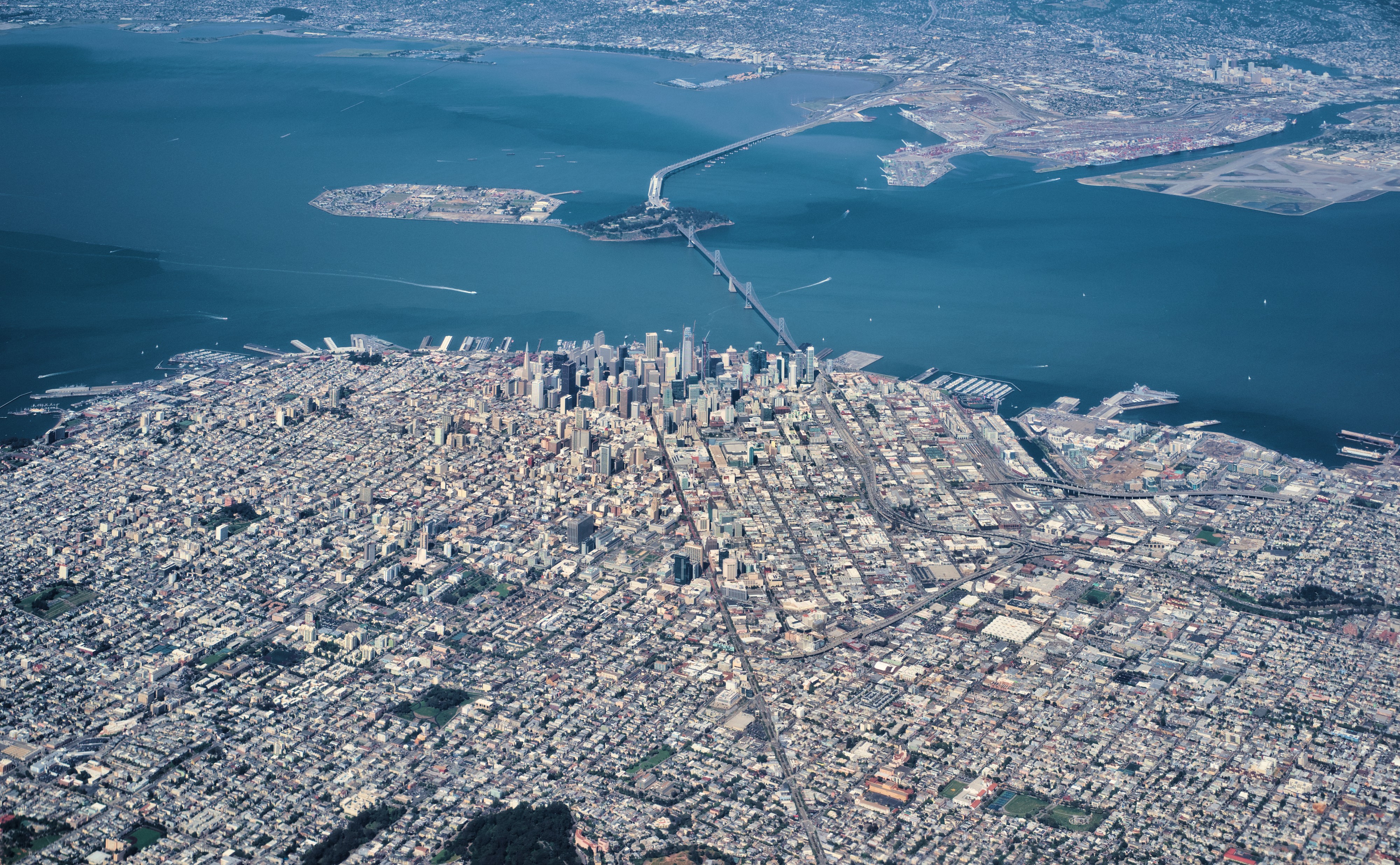 Aerial view of downtown San Francisco, the Bay Bridge, Treasure Island, and Oakland