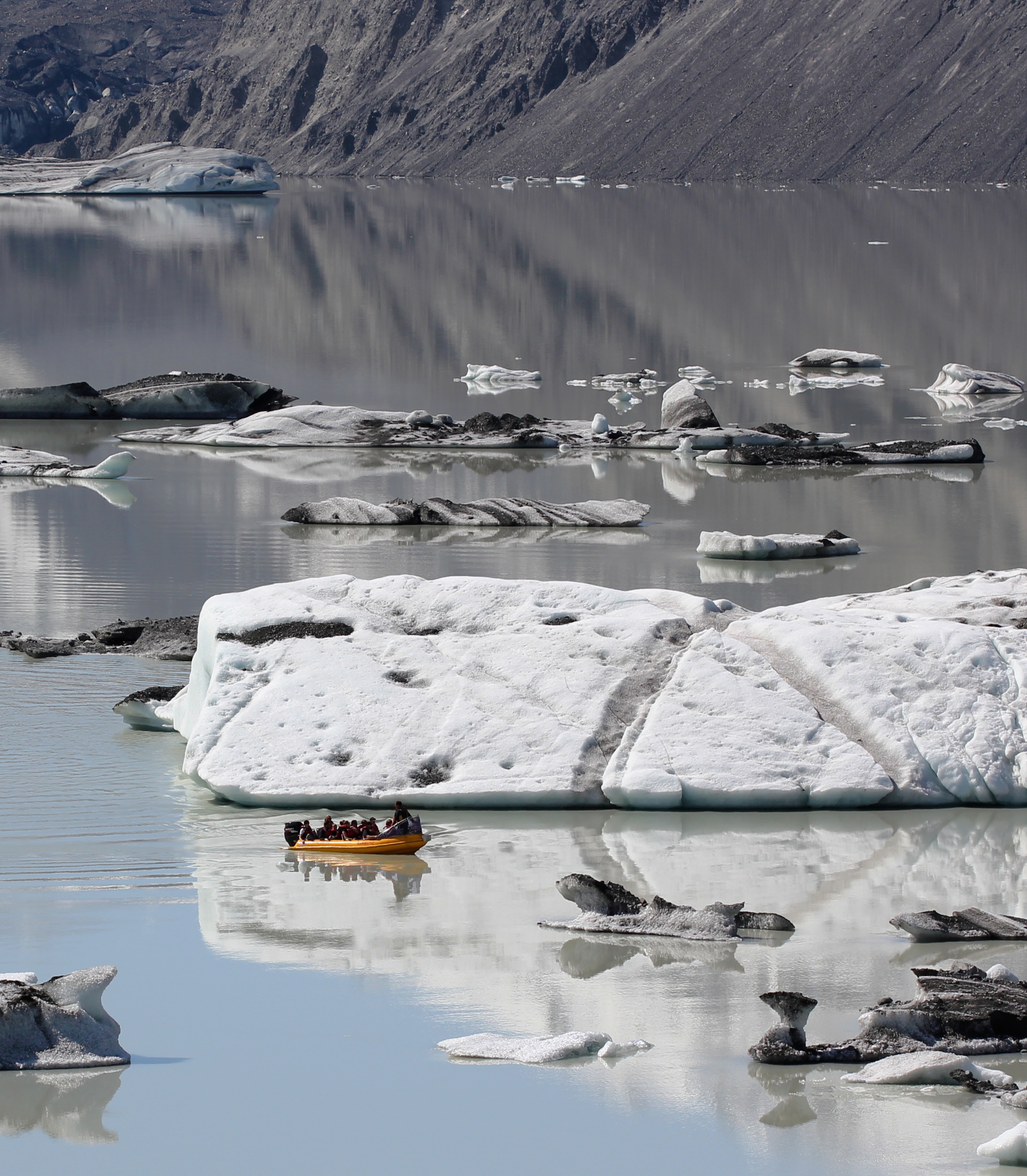 Tour boat among the icebergs on Tasman Lake