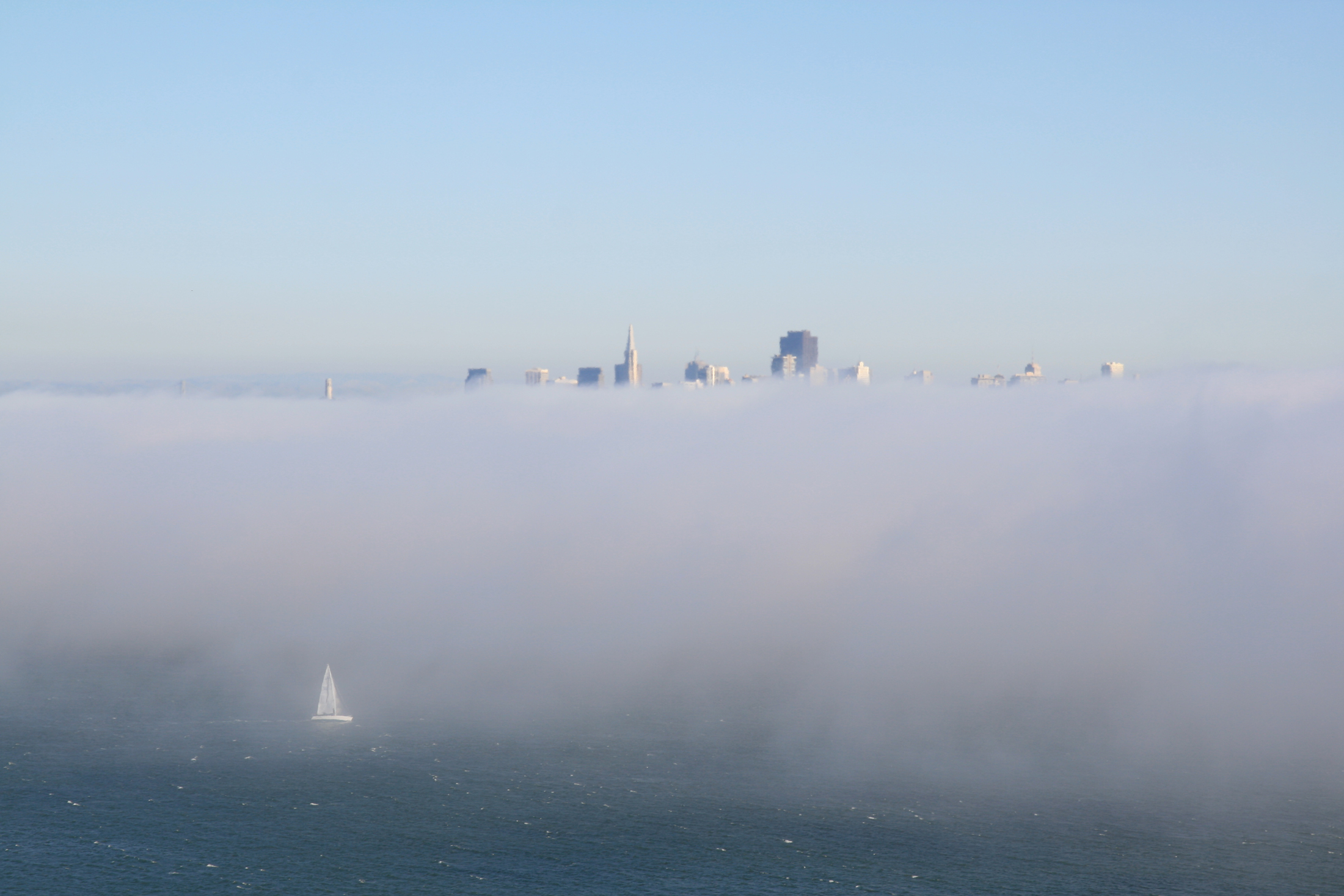 San Franciso in fog and sailboat