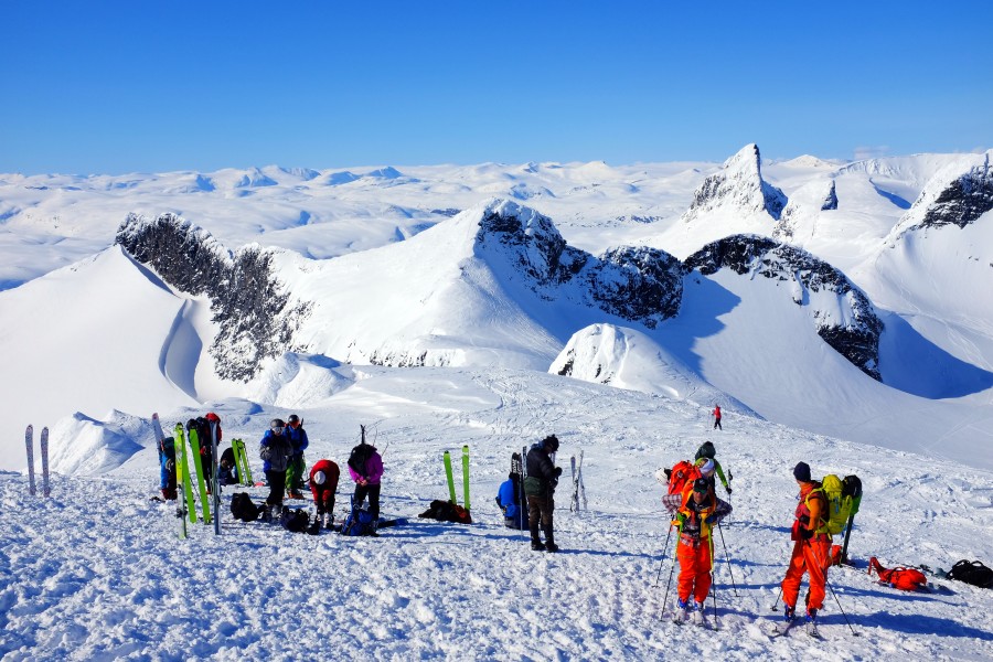 Offpiste skiers getting ready for descent from Storebjørn