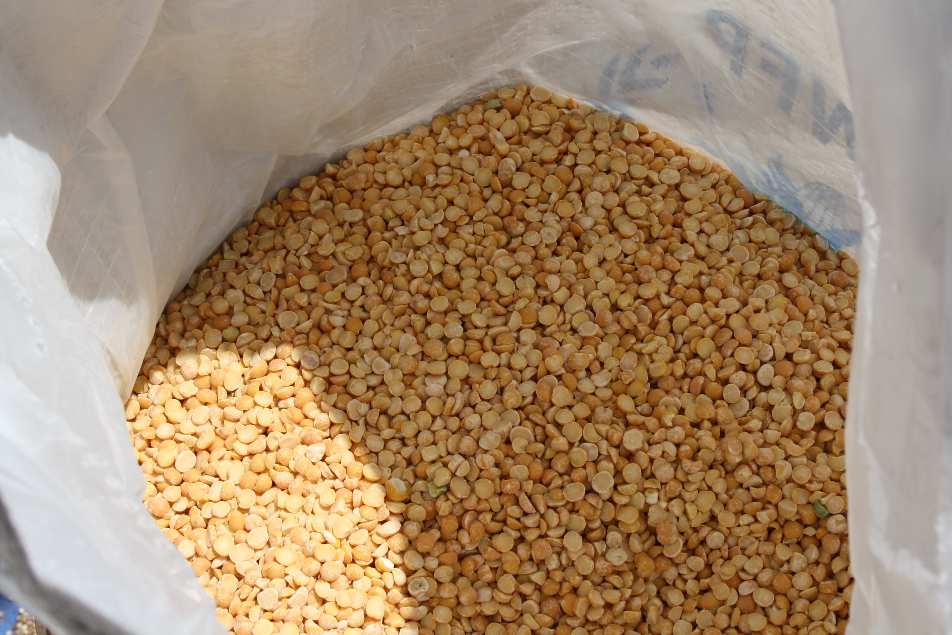 A sack of split peas awaits distribution at a joint WFP ACTED site in central Bamako, Mali (8511068596)