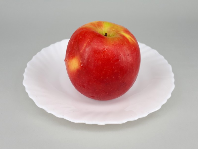 Red apple on a plate 2017 A