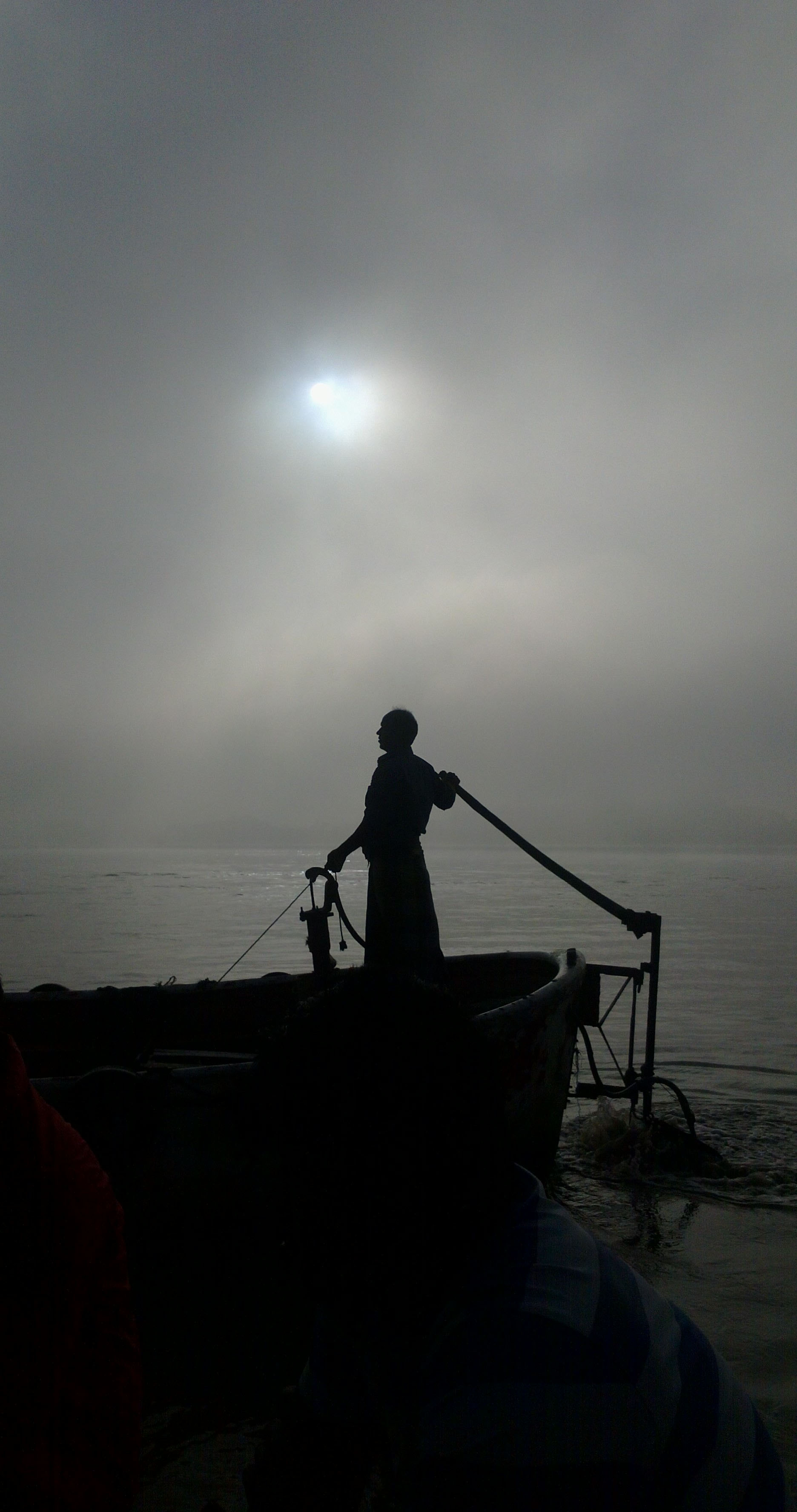 Boat man & sun