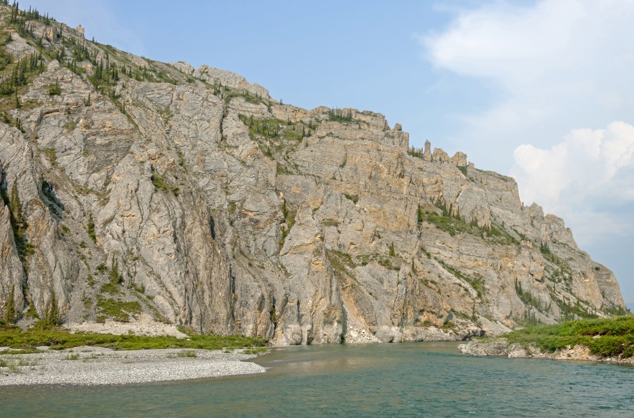 Rock face overlooking Firth River at Muskeg Creek confluence, Ivavvik National Park, YT