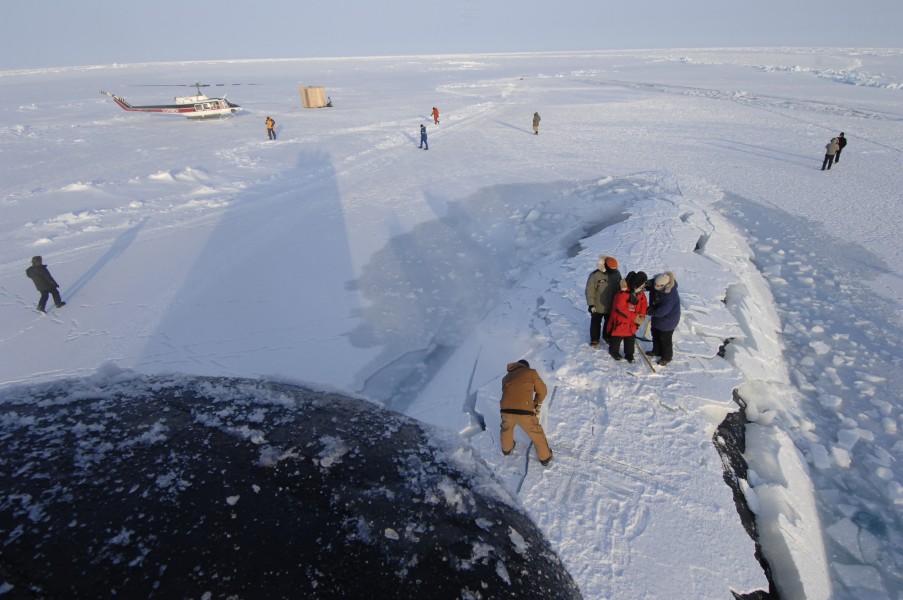 US Navy 070318-N-3642E-141 Sailors clear away ice from the crew hatch aboard Los Angeles-class fast attack submarine USS Alexandria (SSN 757)
