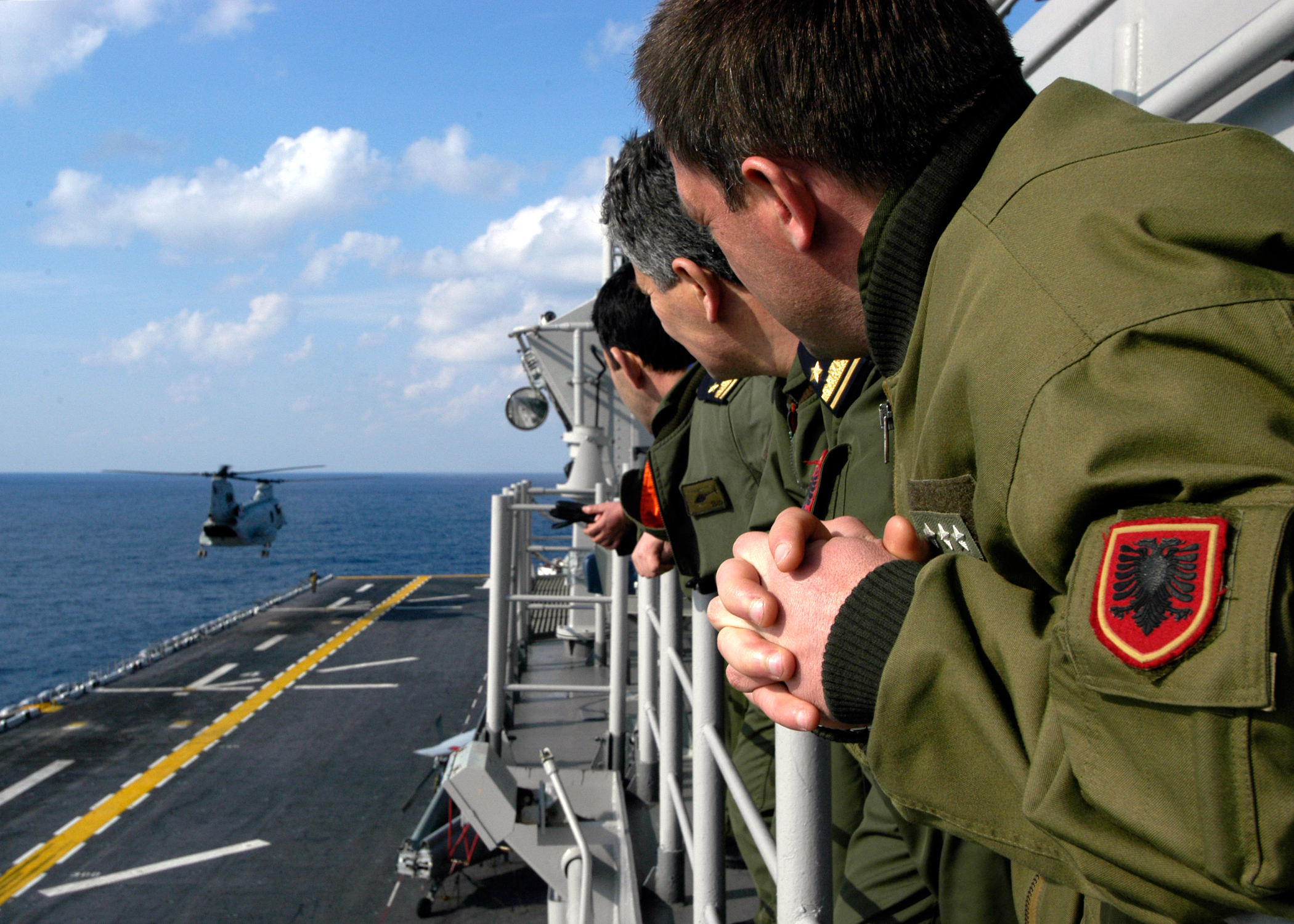 US Navy 040310-N-6380E-039 Albanian Navy pilots aboard the amphibious assault ship USS Wasp (LHD 1) viewed flight operations as an effort to familiarize friendly nations with Wasp^rsquo,s mission