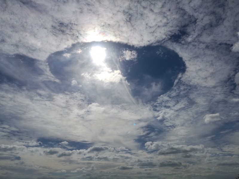 A fallstreak hole over one of the Egyptian villages