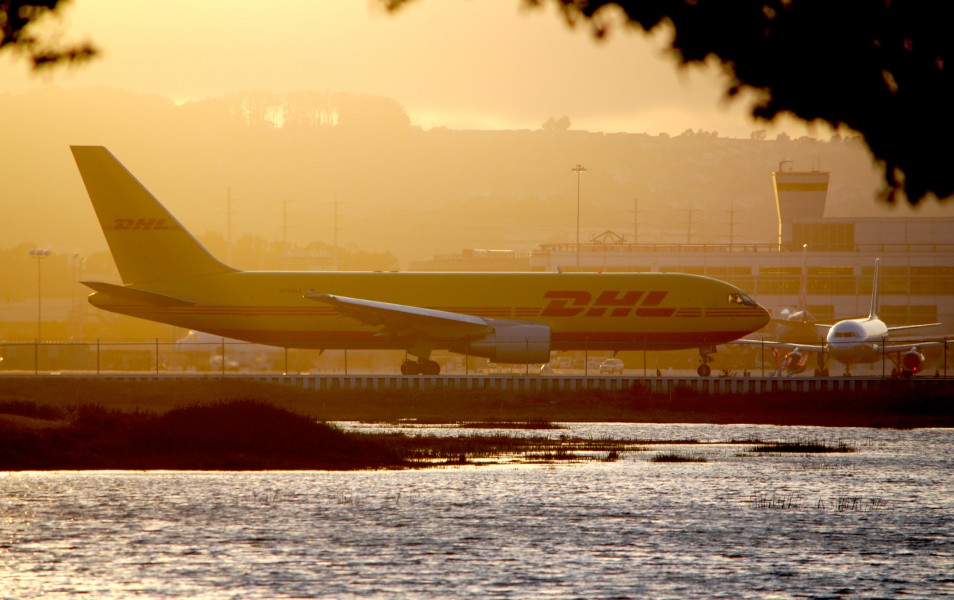 Boeing 767-200 DHL in a golden glow at SFO... (7359031054)