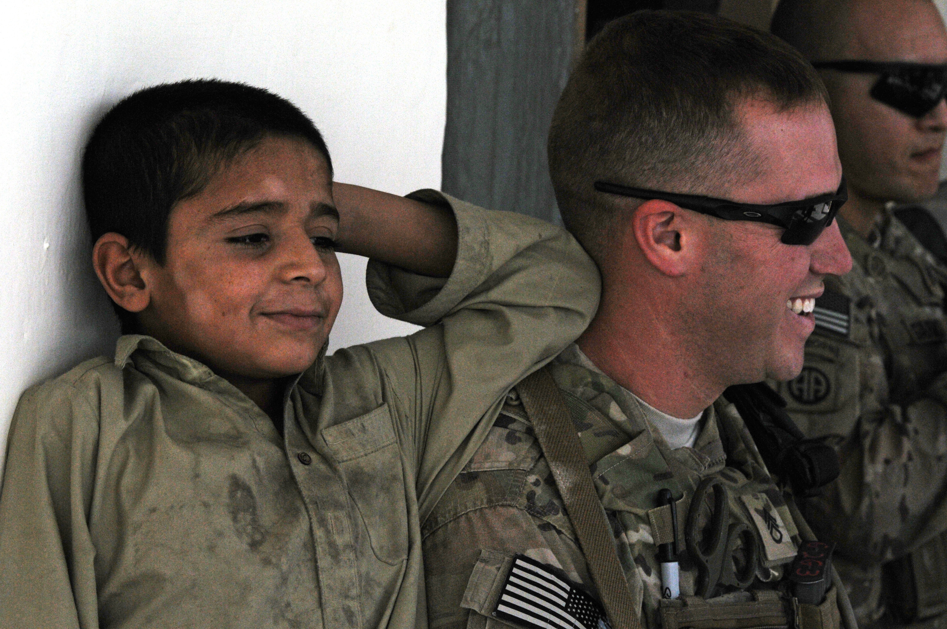 82nd Airborne Division medic interacts with Afghan child DVIDS483314