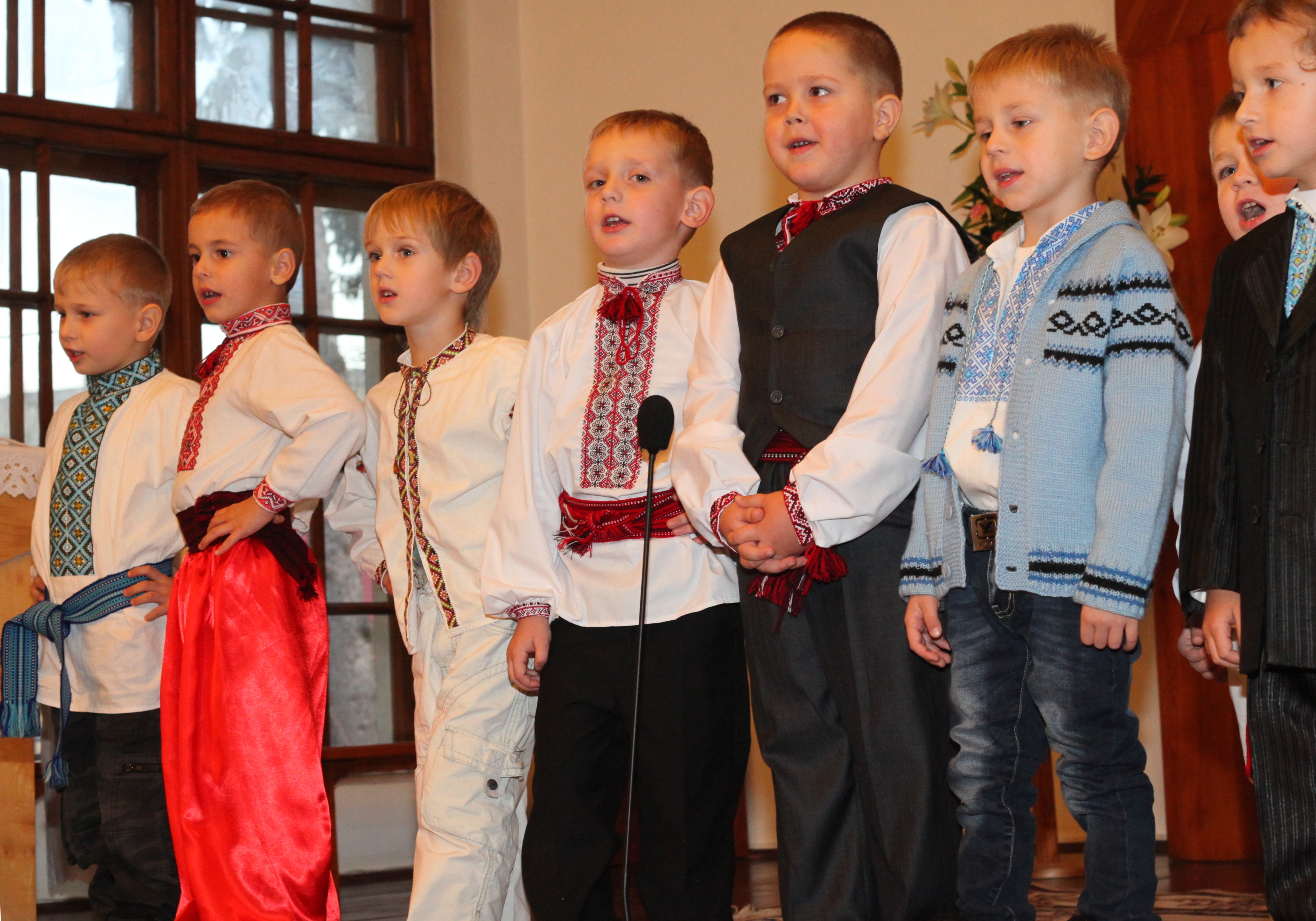 child boys performing in a Catholic kindergarten