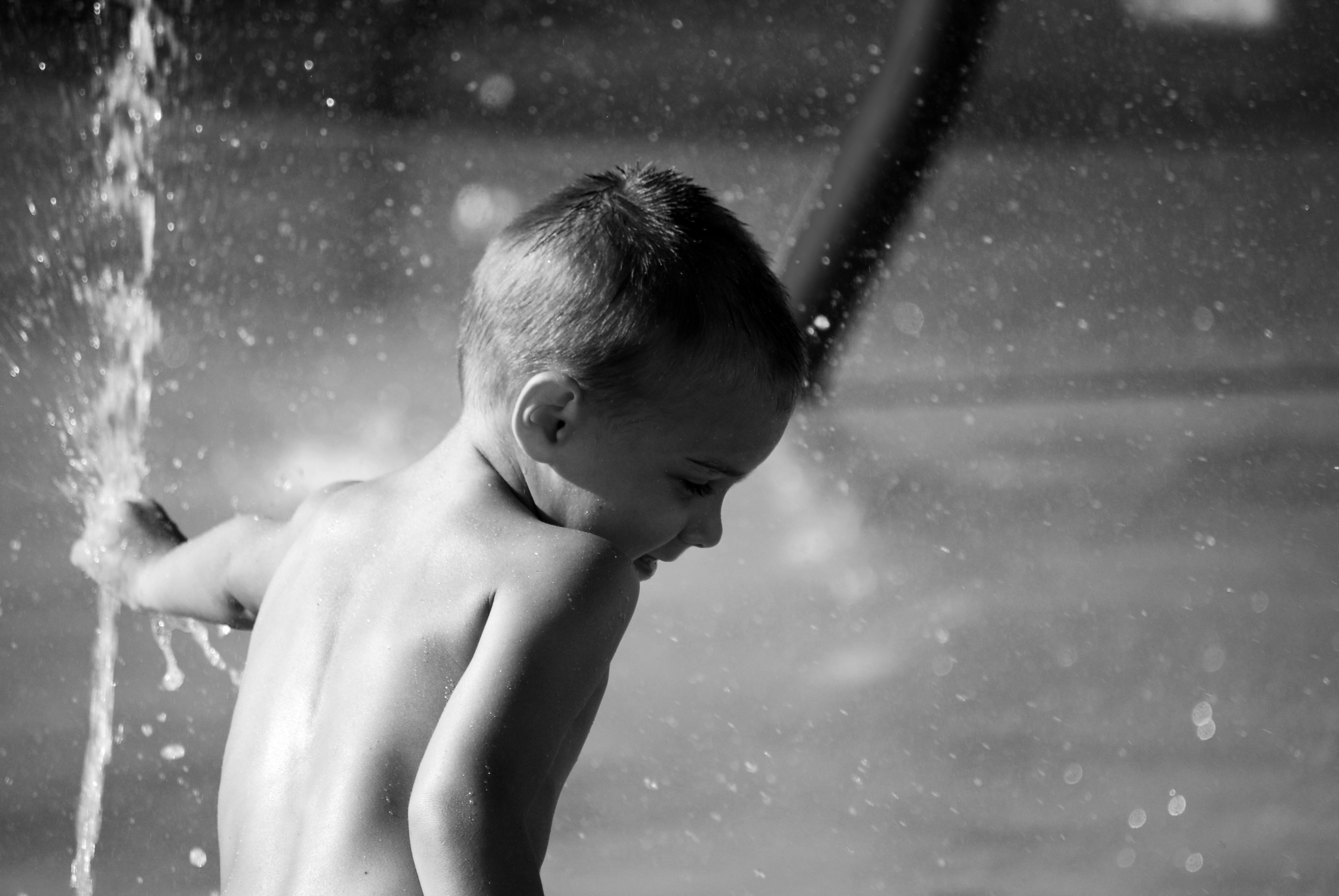 Little Boy in Sprinkler