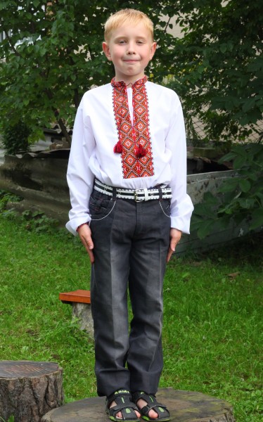 A boy in an embroydered shirt