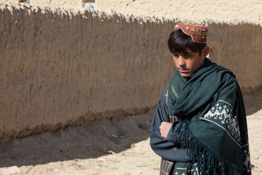 A boy walks down a street in Nyalak Kalay village, Zabul province, Afghanistan, Dec. 7, 2011 111207-A-QD683-102