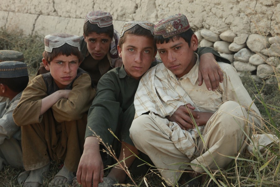 Afghan boys pose for a photo during a shura on patrol base Mahteen, Sangin, Afghanistan Nov. 4, 2011 111104-M-BE571-032