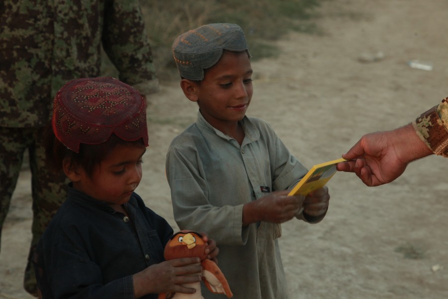Afghan boys receive toys and school supplies from the Afghan National Army during a shura on patrol base Mahteen, Sangin, Afghanistan Nov. 4, 2011 111104-M-BE571-127