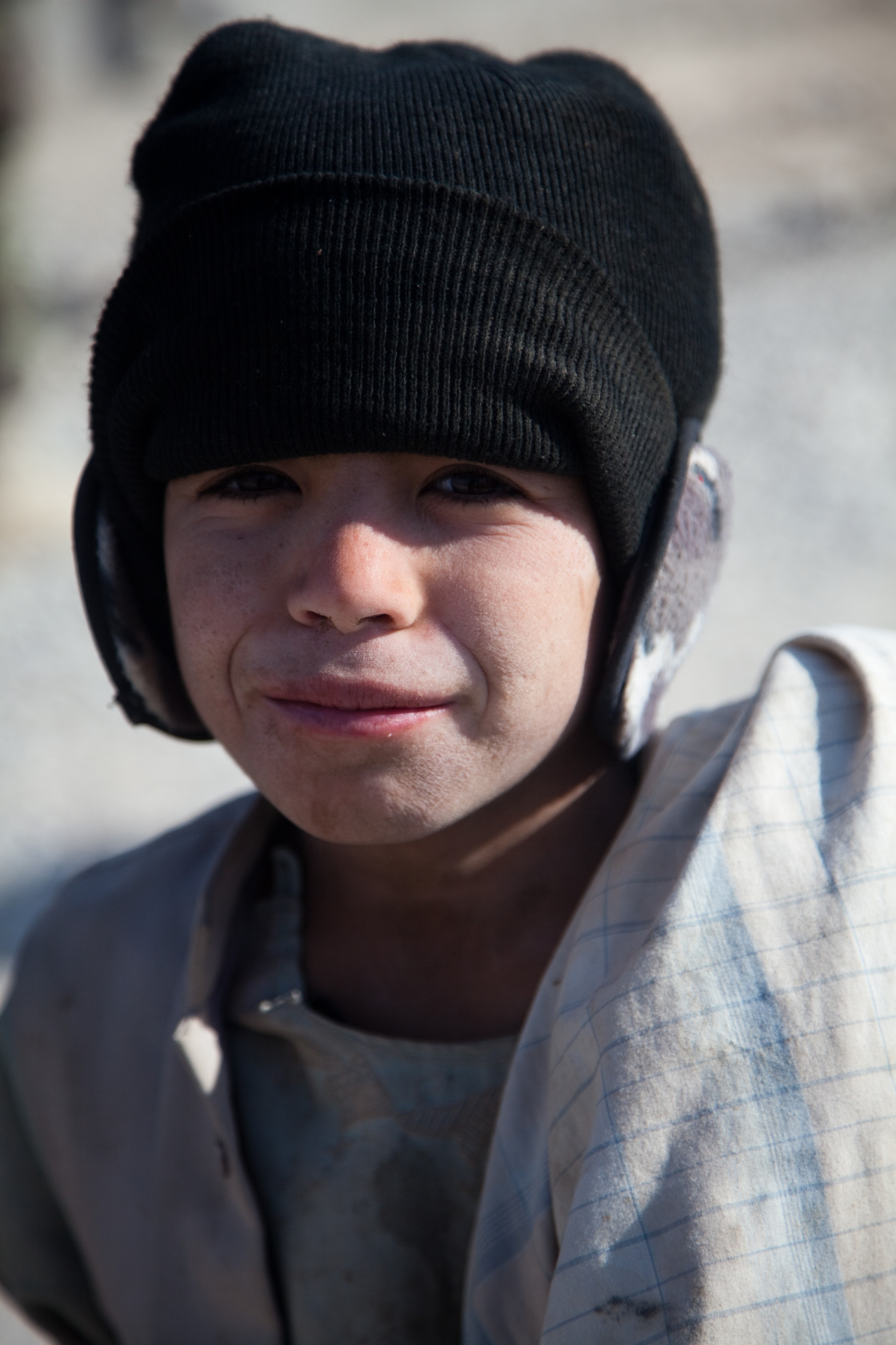 A boy poses for a photograph in the Ananzai village in Kandahar province, Afghanistan, Dec. 26, 2011 111226-A-VB845-047